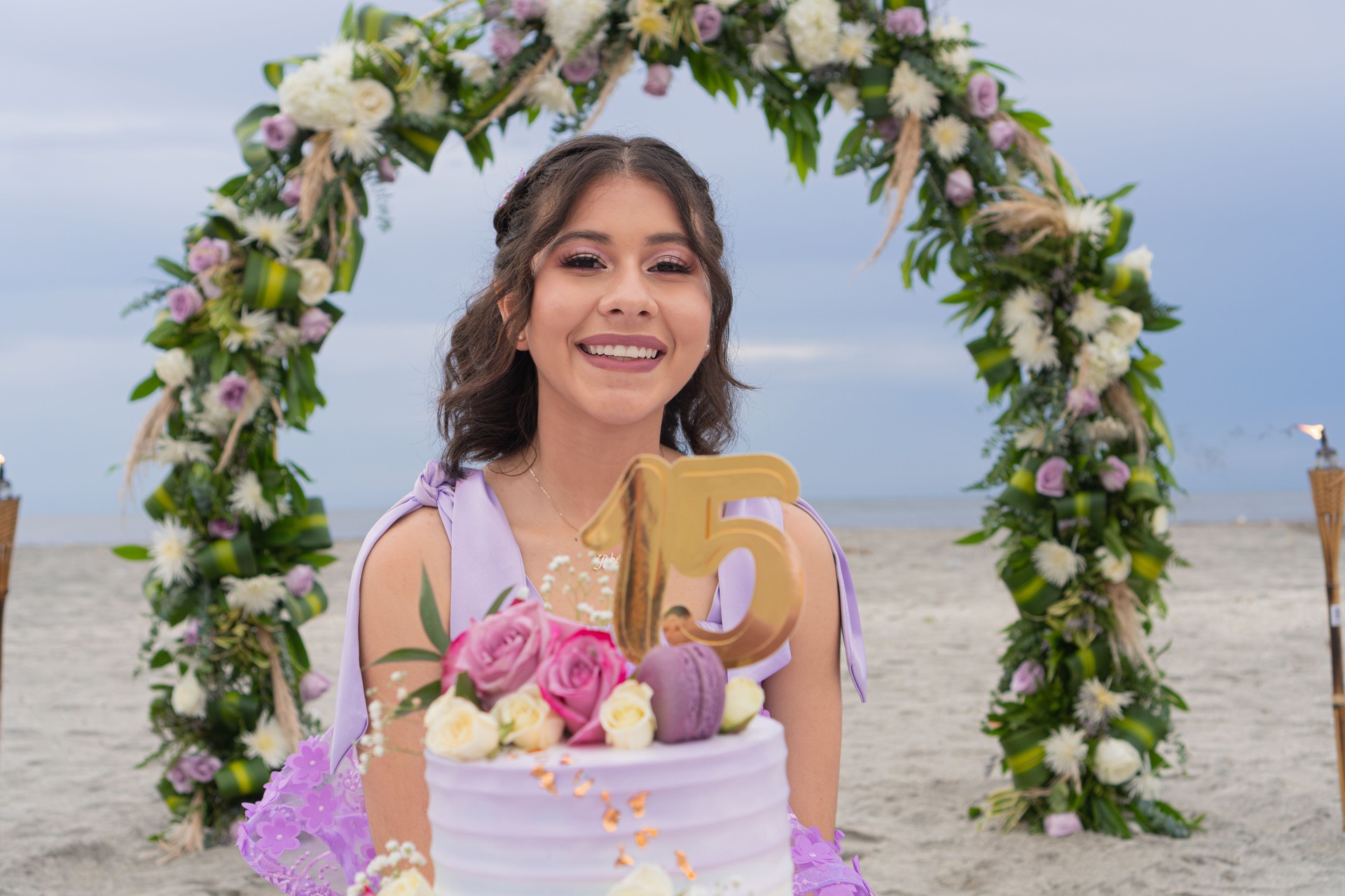 A girl sits at a 15th birthday party.